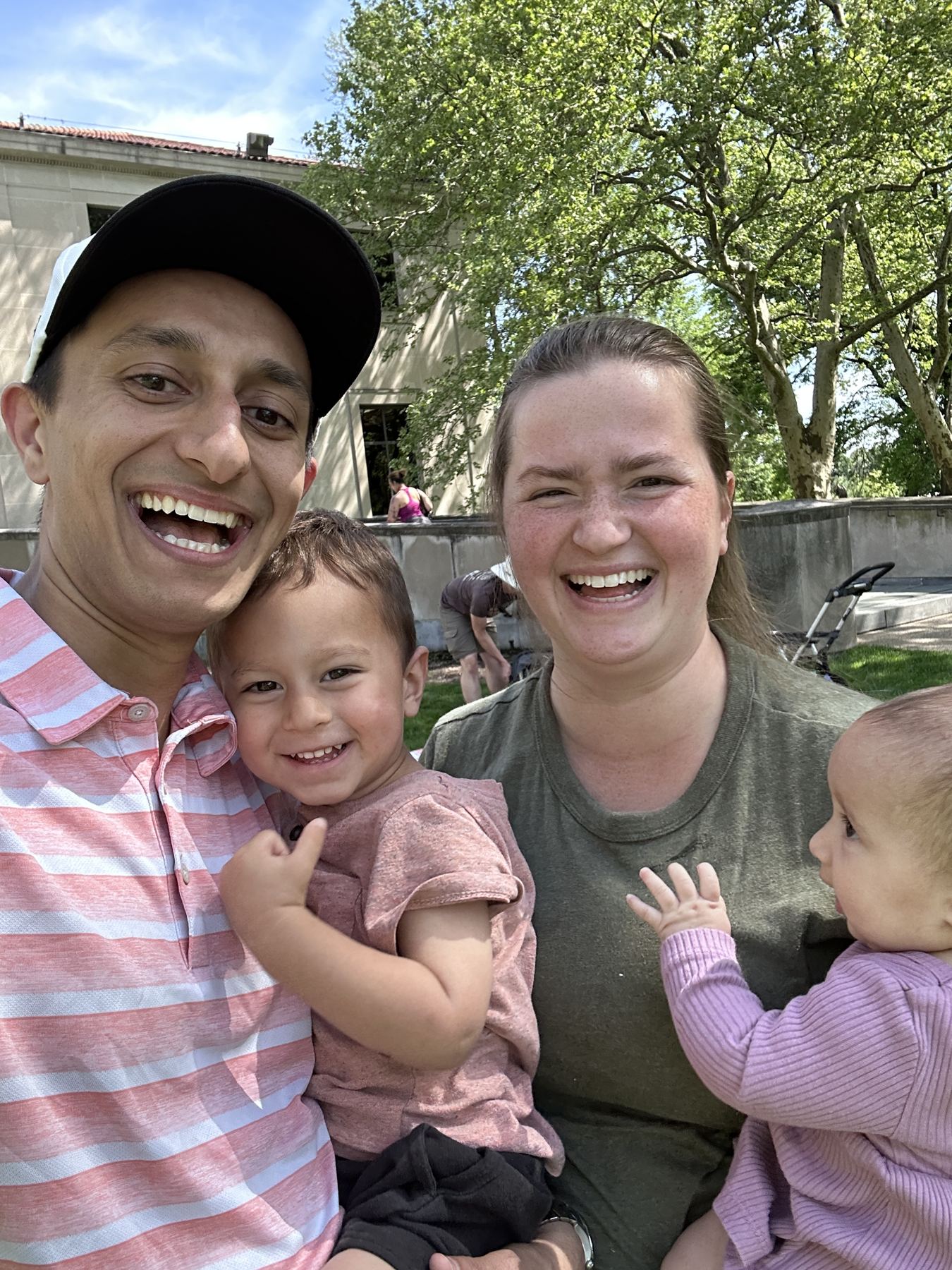 Josh and Elizabeth Allen with their two little kids at an outreach