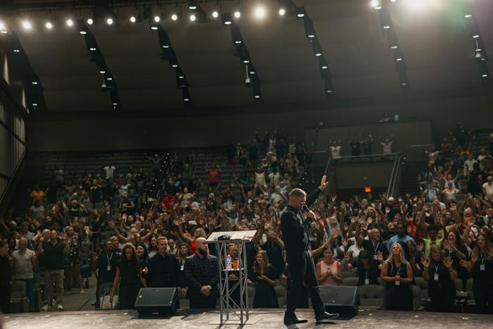 A packed auditorium during a crusade service