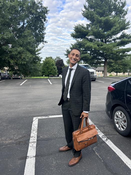 Josh in a suit before a service