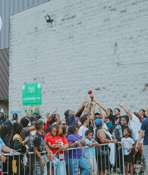 A crowd lined up along the barrier