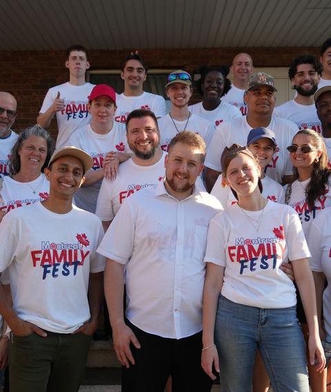 A volunteer team in matching shirts before an outreach