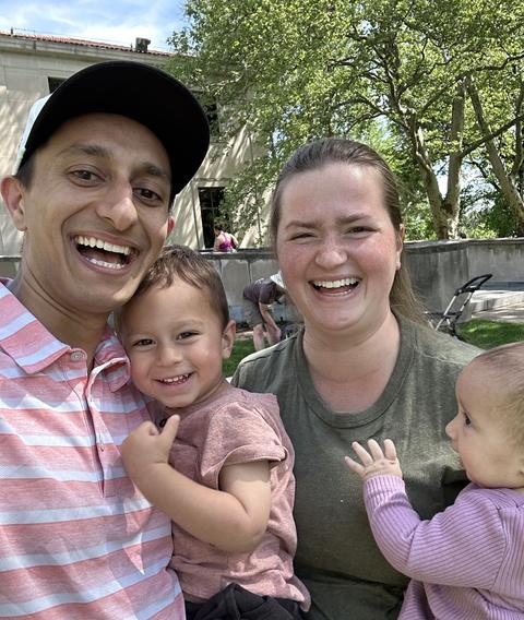 Josh and Elizabeth Allen with their two little kids at an outreach