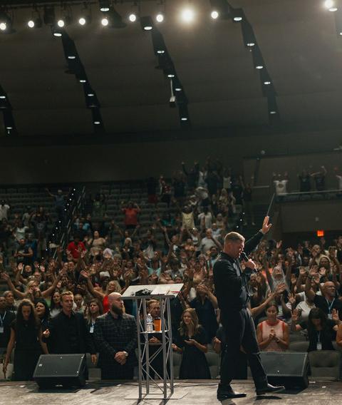A packed auditorium during a crusade service