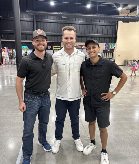 Three team members at an outreach