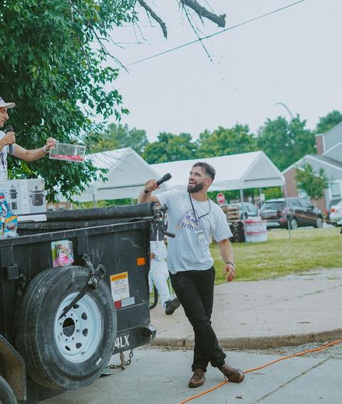 A trailer used as a stage with the MC leading the crowd