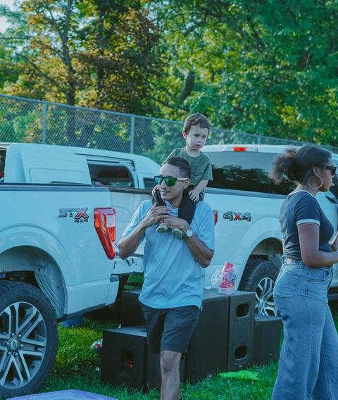 A crowd gathered around a pickup truck stage